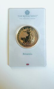Luxurious gold Britannia coin encapsulated by The Royal Mint. A collector's treasure from the UK.